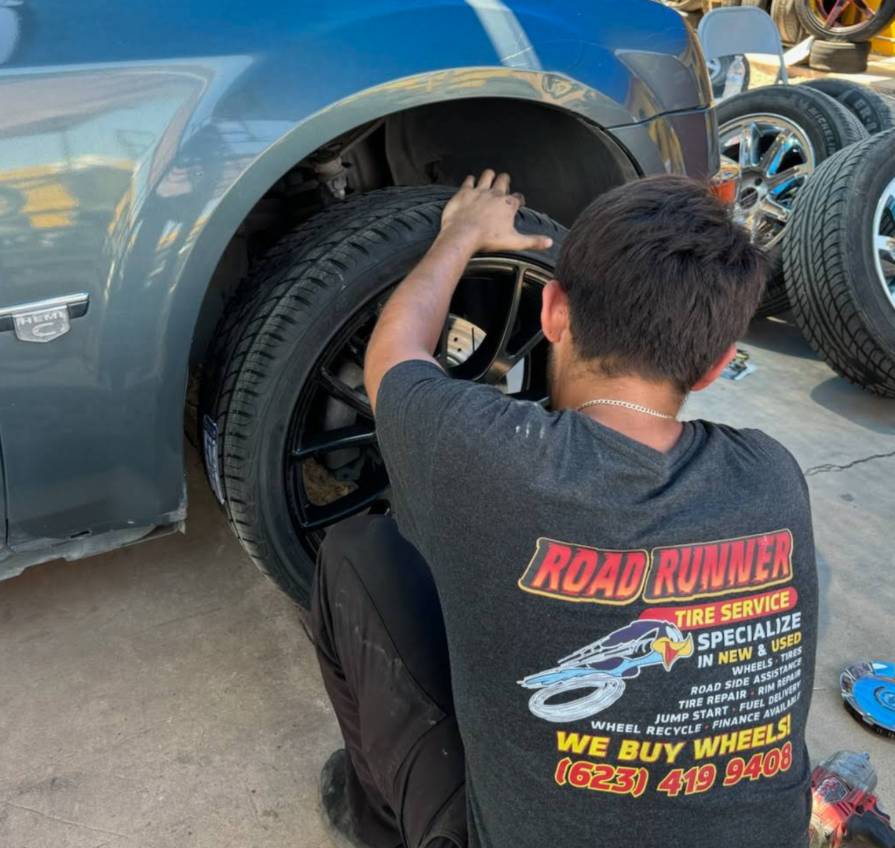 Technician mounting a tire